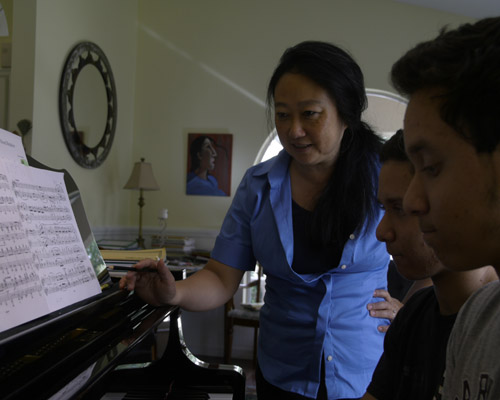 students working on four hands